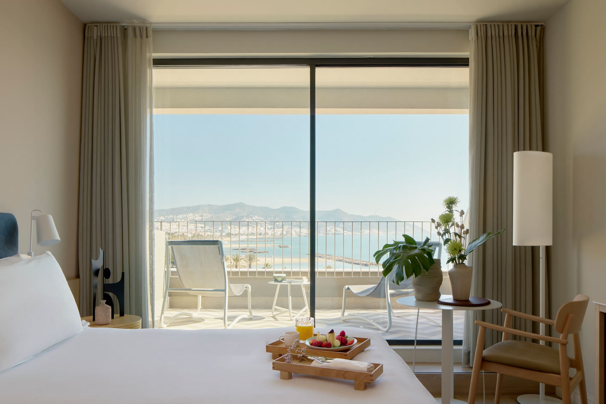 a room with a bed and a table with chairs and a table with chairs and a table with chairs and a table with chairs and a table with chairs and a table with chairs and a table with