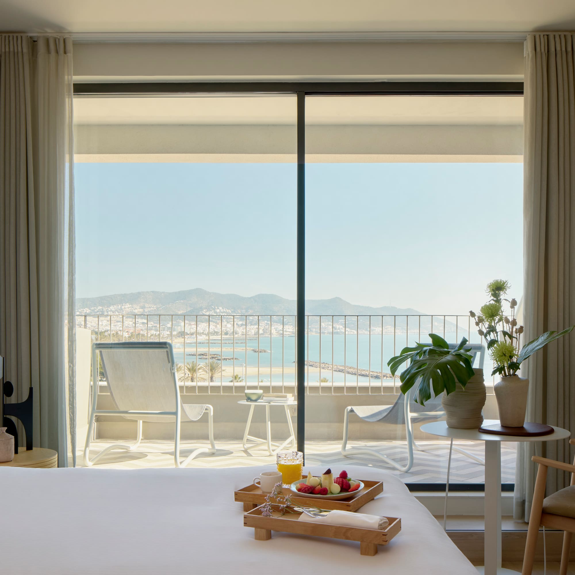 a room with a bed and a table with chairs and a table with chairs and a table with chairs and a table with chairs and a table with chairs and a table with chairs and a table with