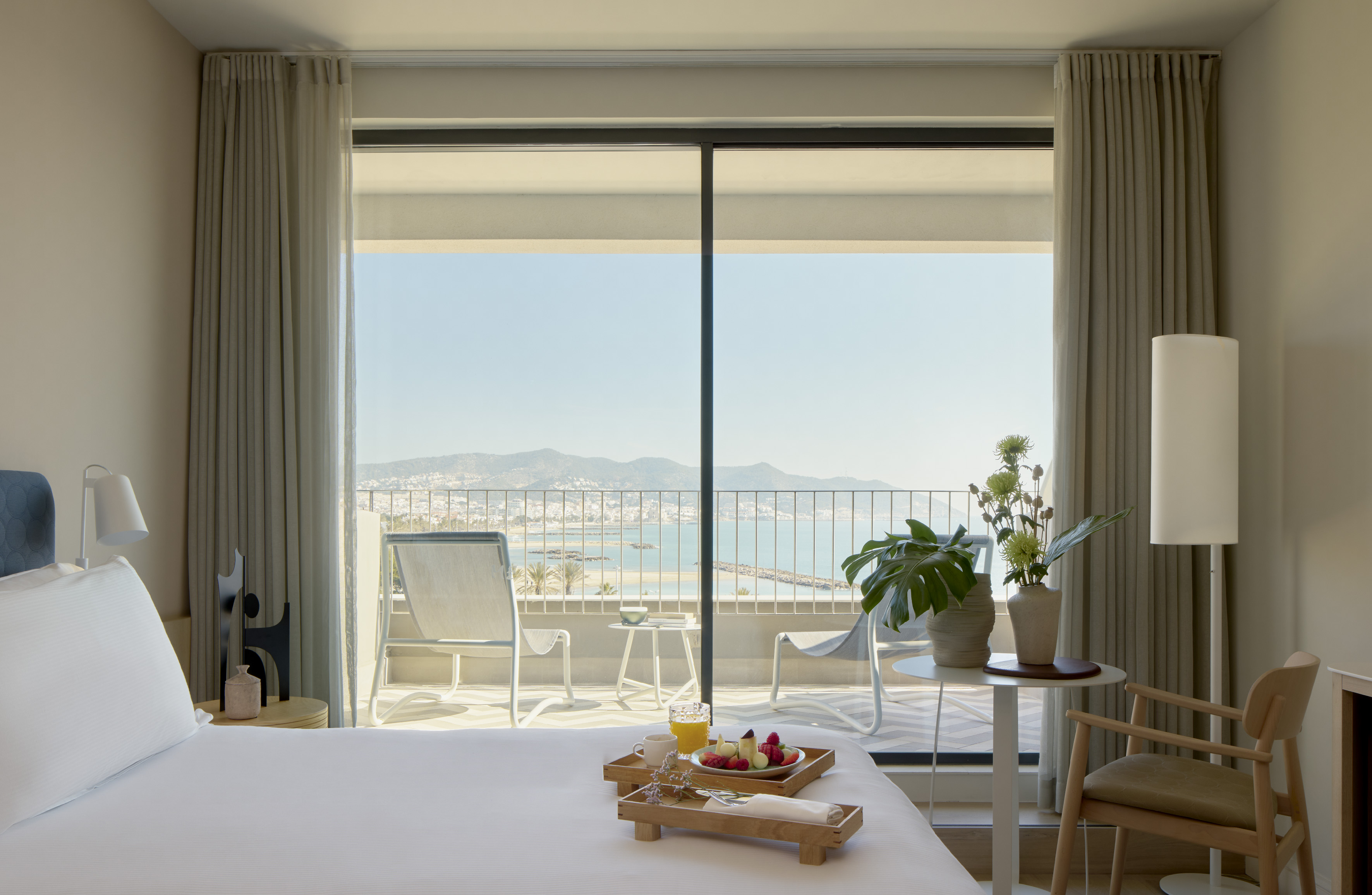 a room with a bed and a table with chairs and a table with chairs and a table with chairs and a table with chairs and a table with chairs and a table with chairs and a table with