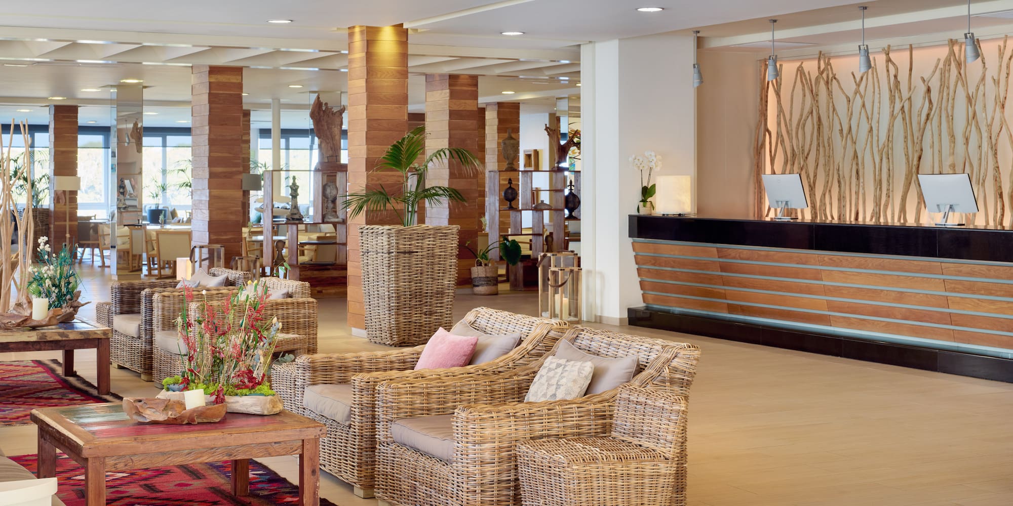 a lobby with a reception desk and chairs