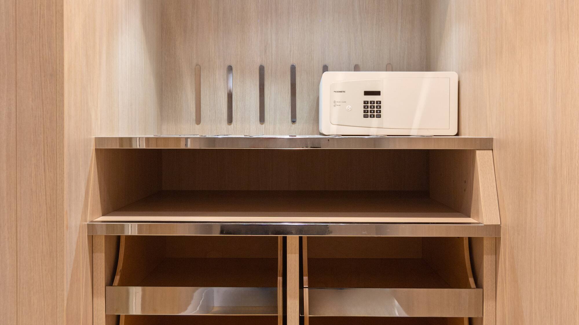 a white microwave on a shelf