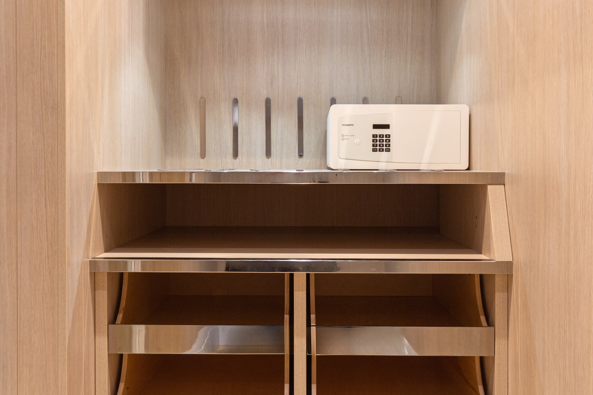 a white microwave on a shelf