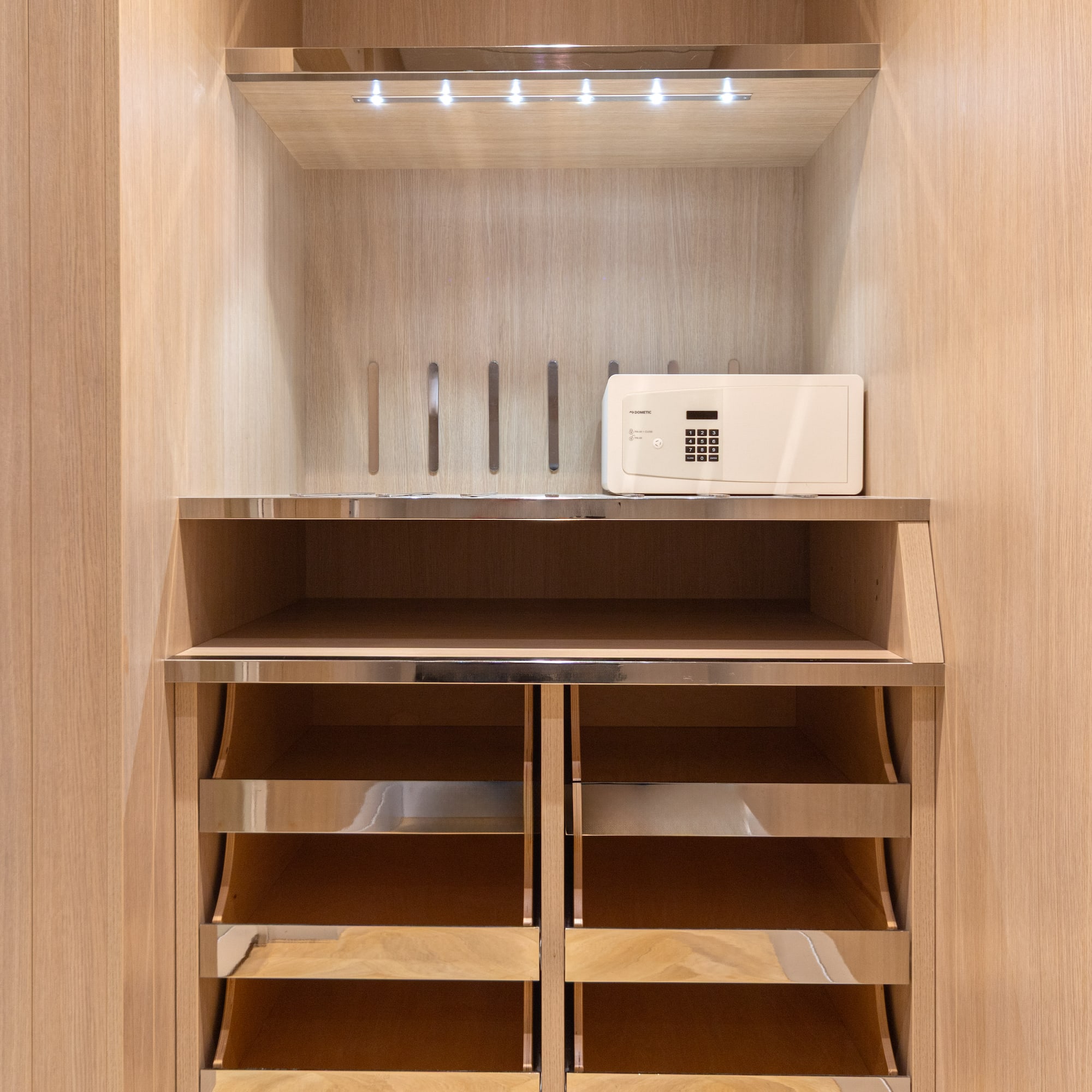 a white microwave on a shelf