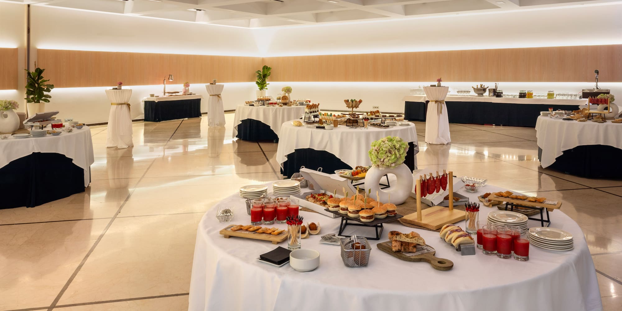 a large room with tables of food