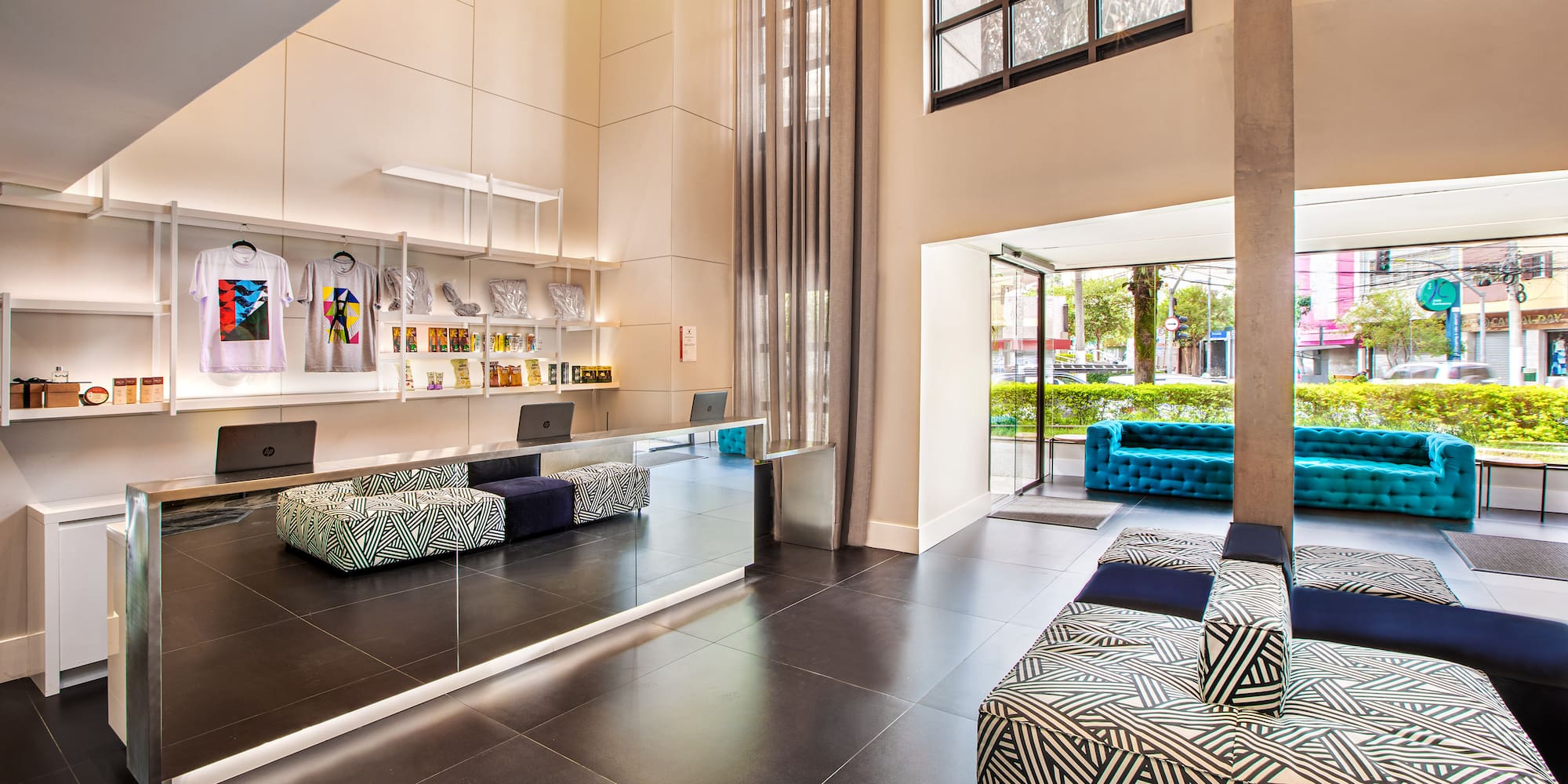 a room with a mirror and couches