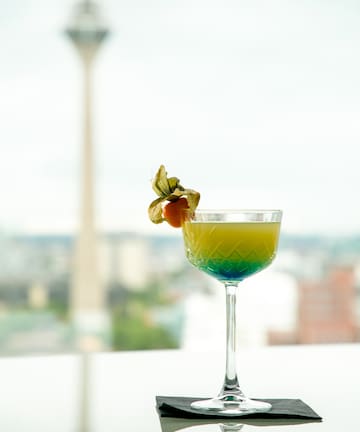 a glass with a drink in it