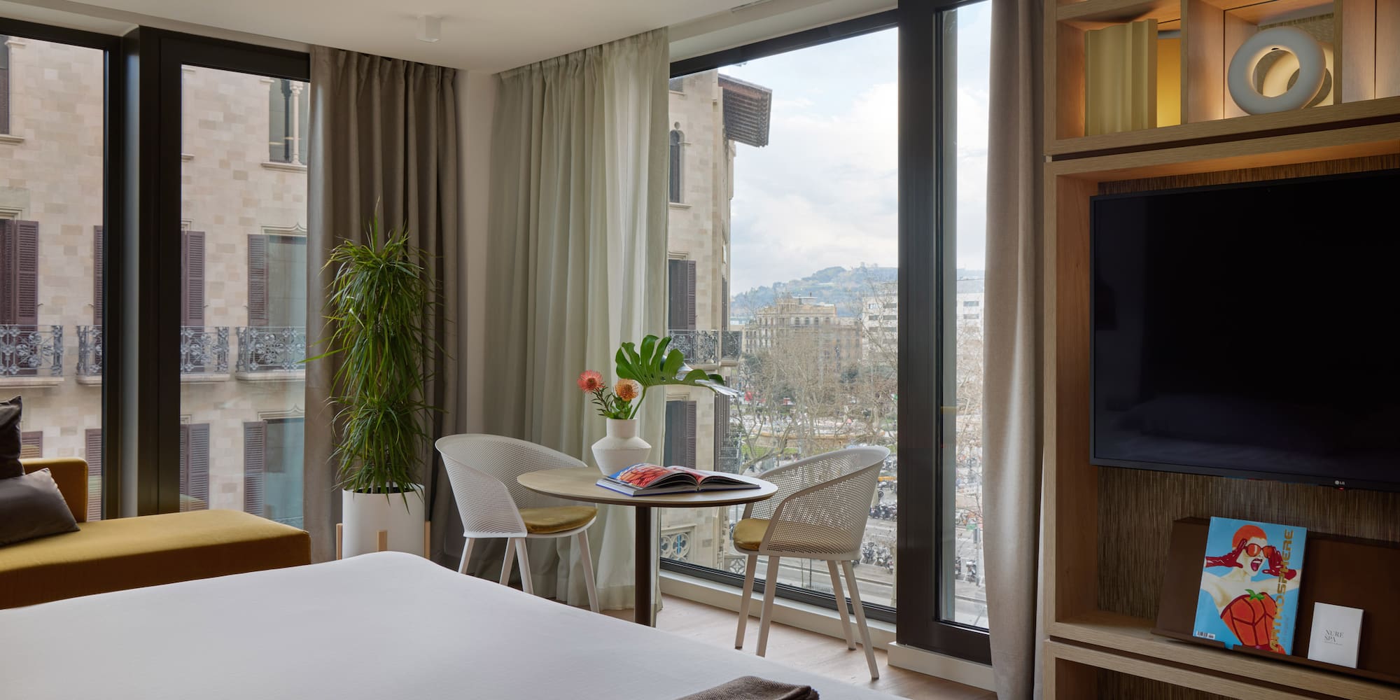 a room with a television and a bed