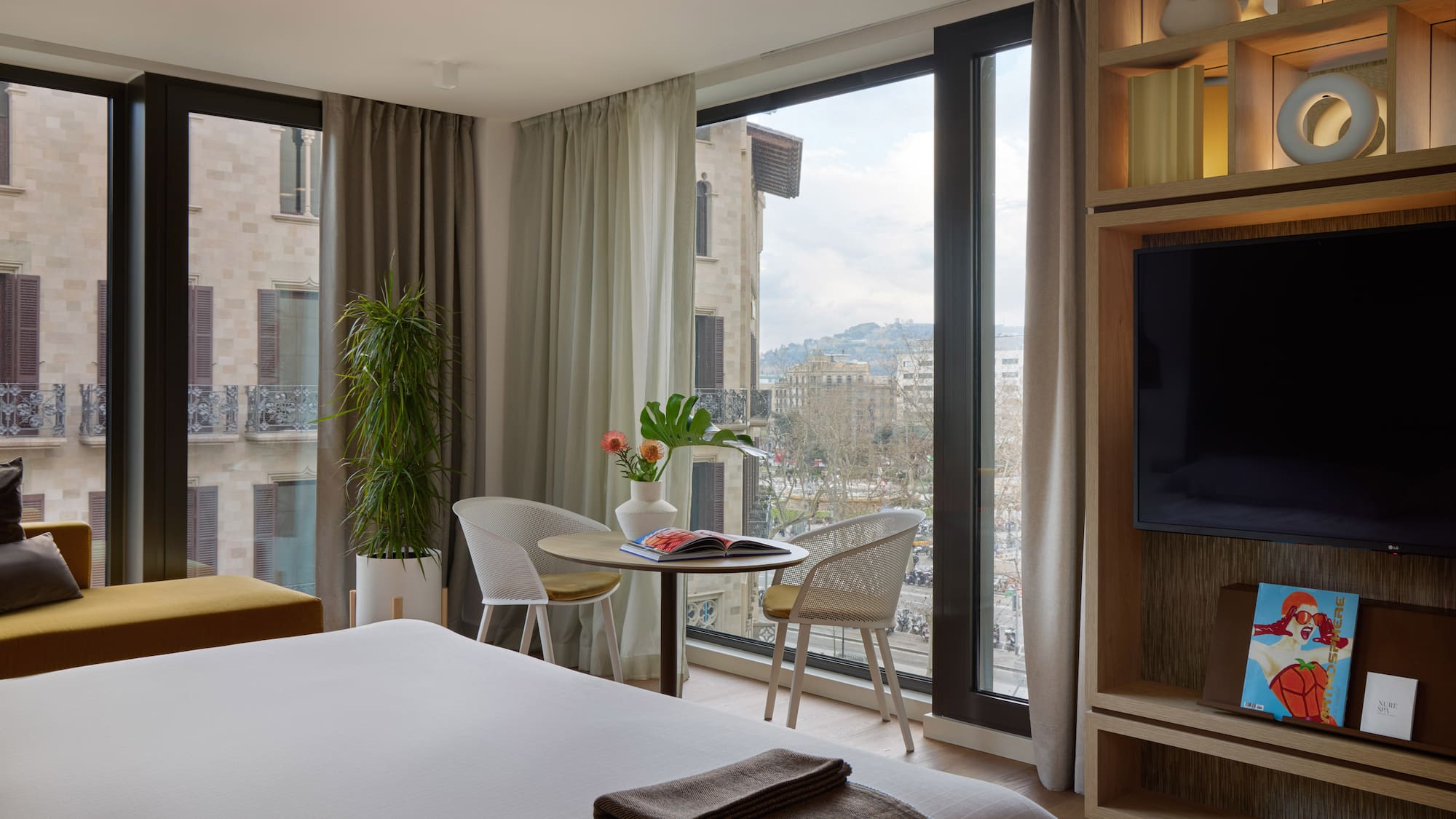 a room with a television and a bed