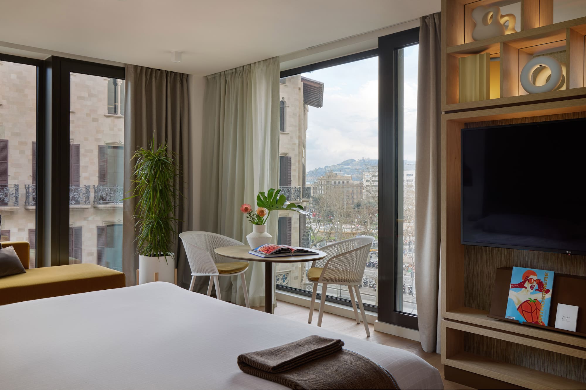 a room with a television and a bed