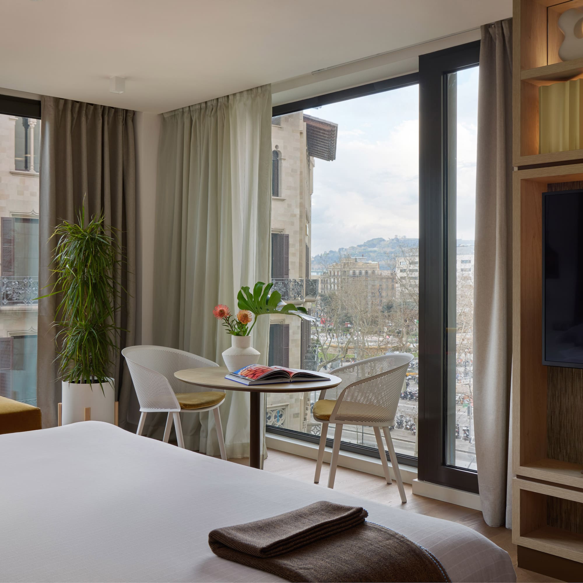 a room with a television and a bed