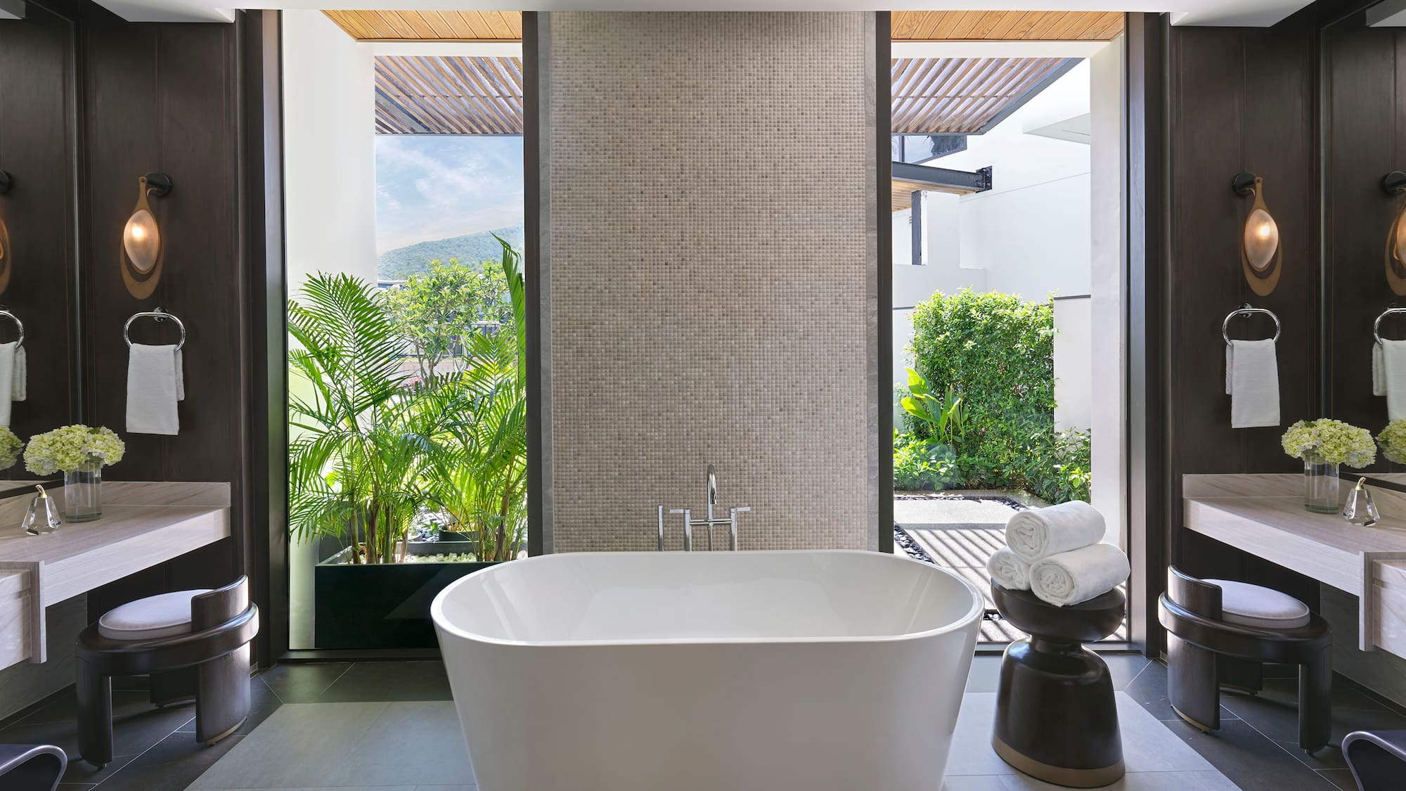 a bathroom with a tub and a sink