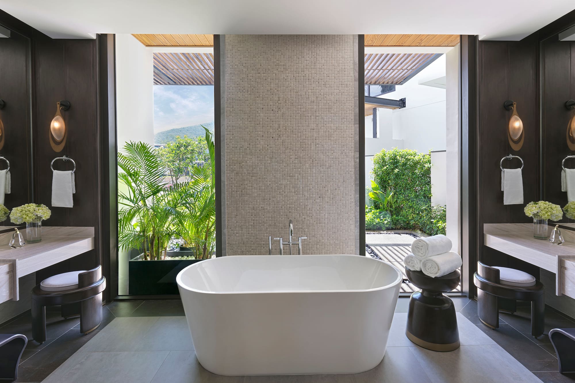 a bathroom with a tub and a sink