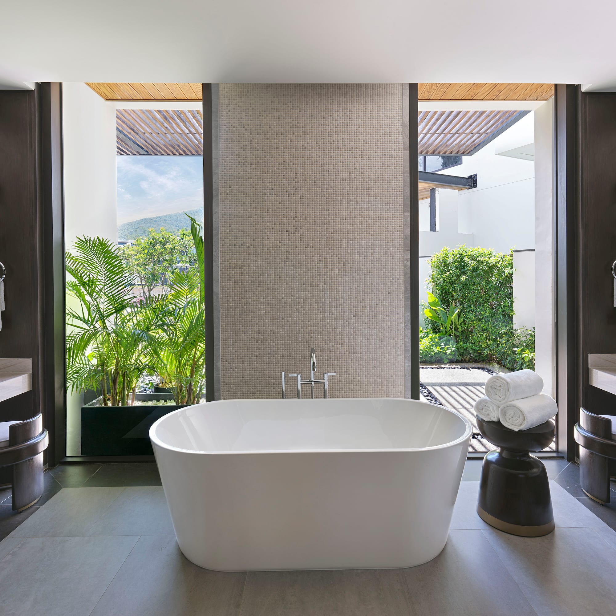 a bathroom with a tub and a sink