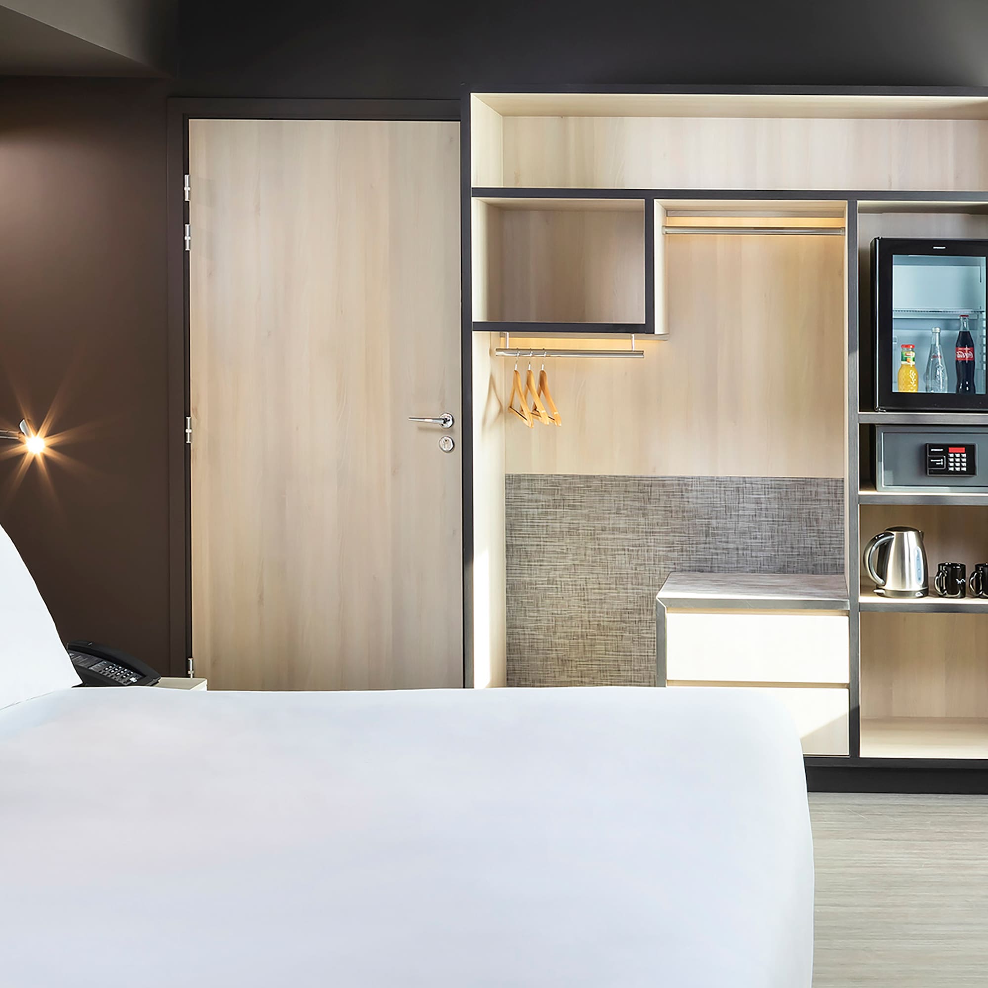 a room with a bed and a microwave