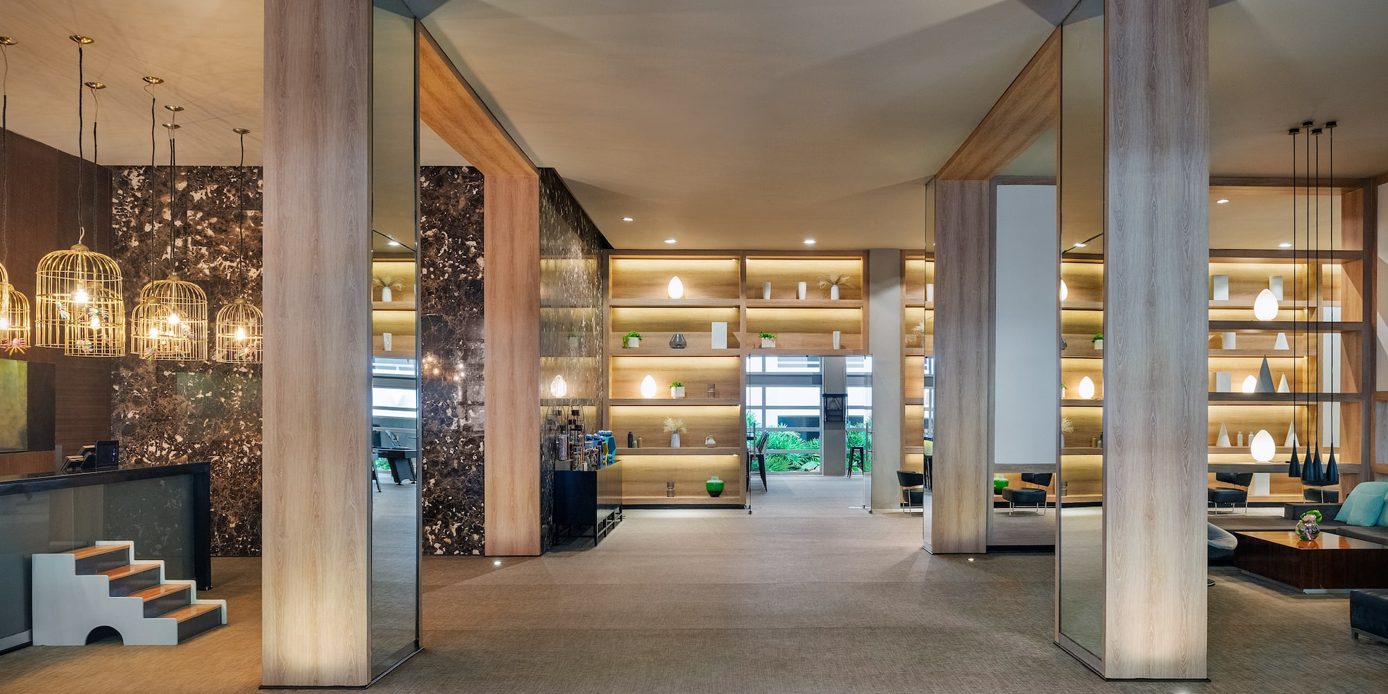 a room with a large wall and shelves