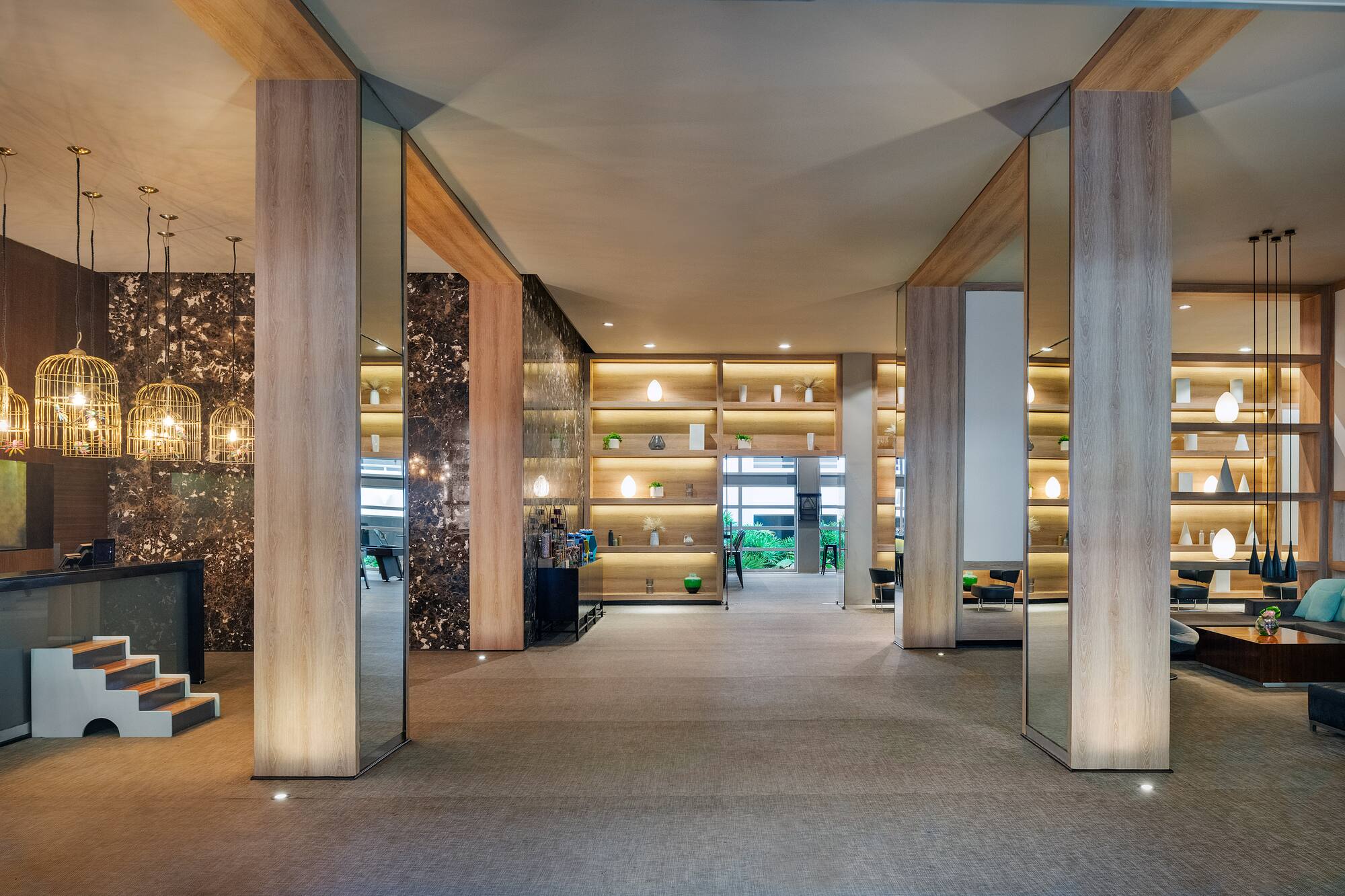 a room with a large wall and shelves