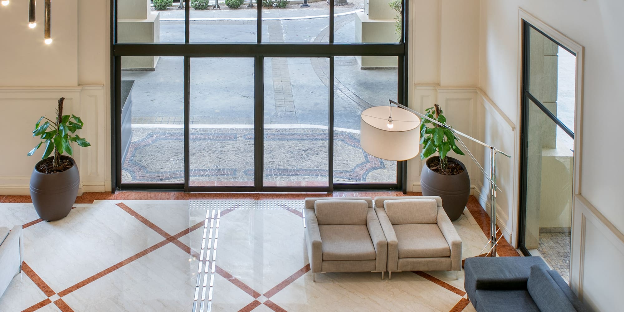 a room with a large window and a couch