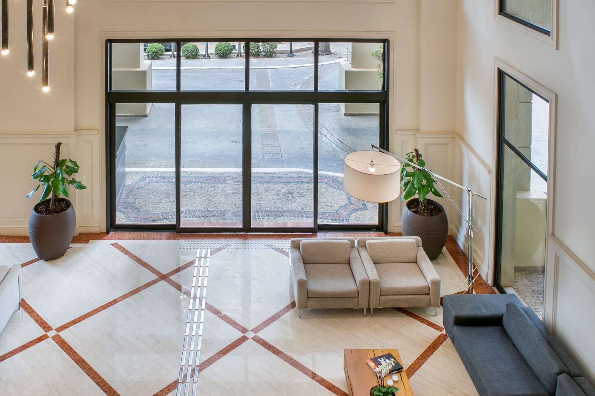a room with a large window and a couch