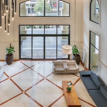 a room with a large window and a couch