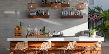 a bar with a counter and stools
