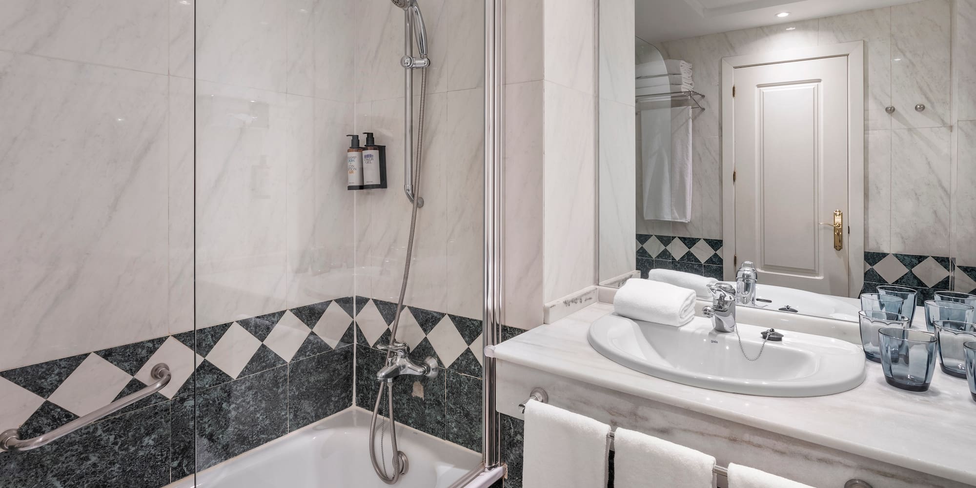 a bathroom with a shower and sink