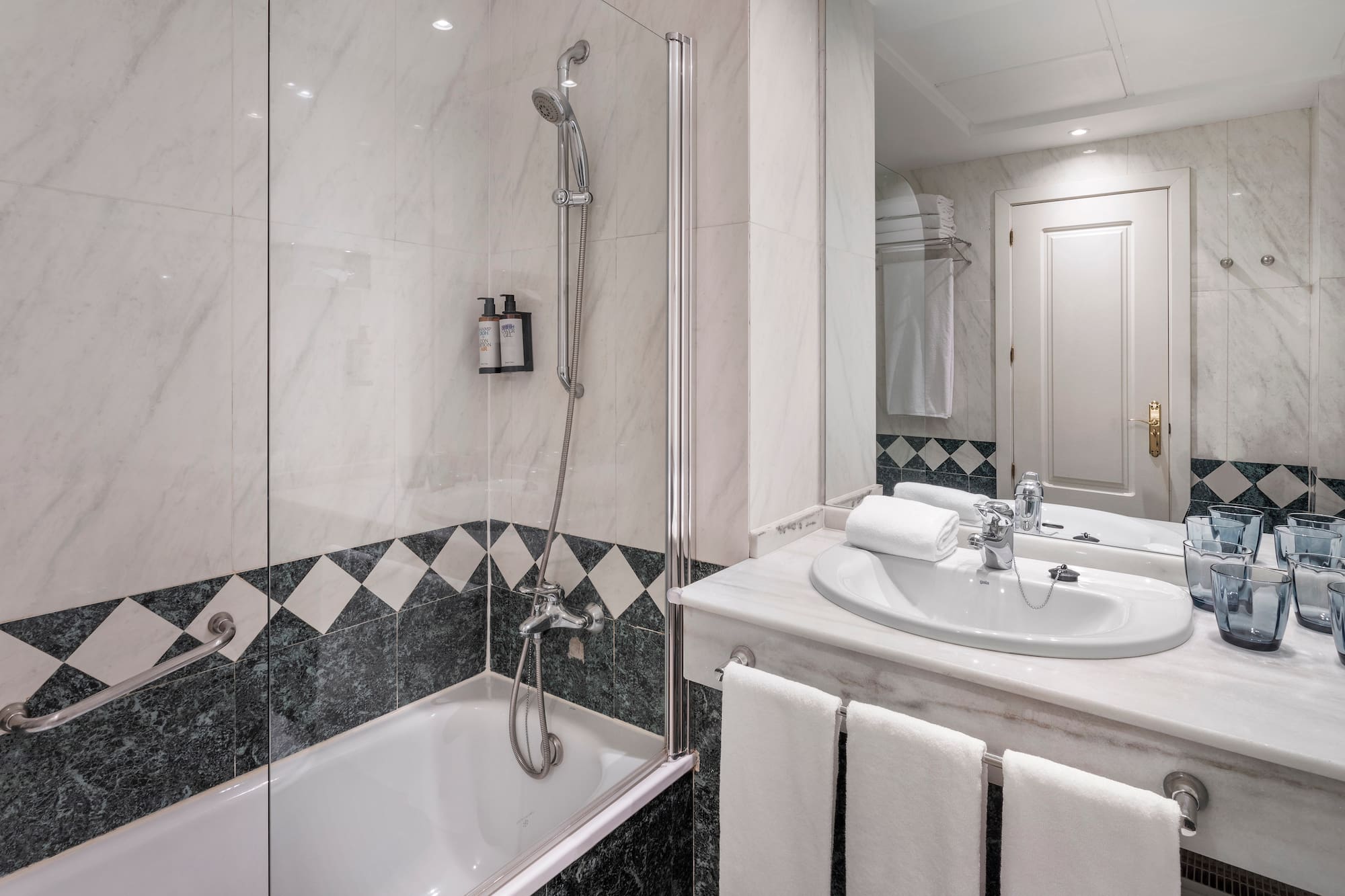 a bathroom with a shower and sink