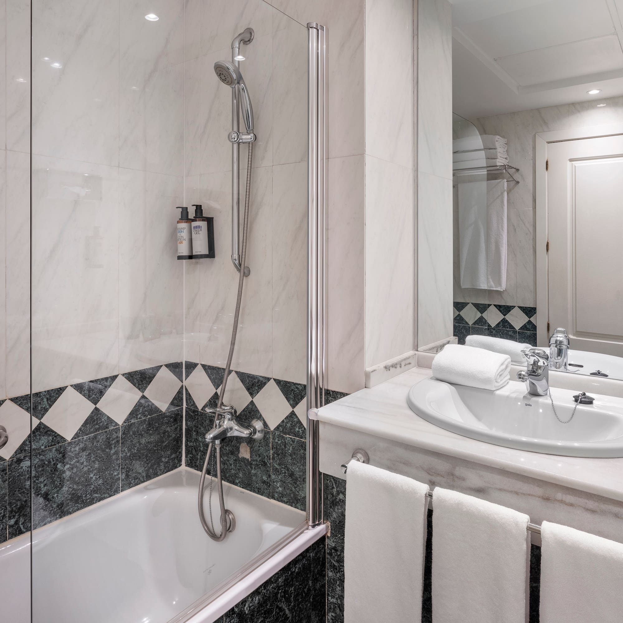 a bathroom with a shower and sink