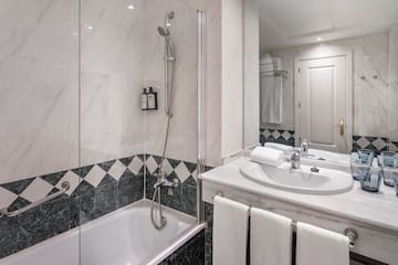 a bathroom with a shower and sink