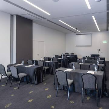 a room with tables and chairs