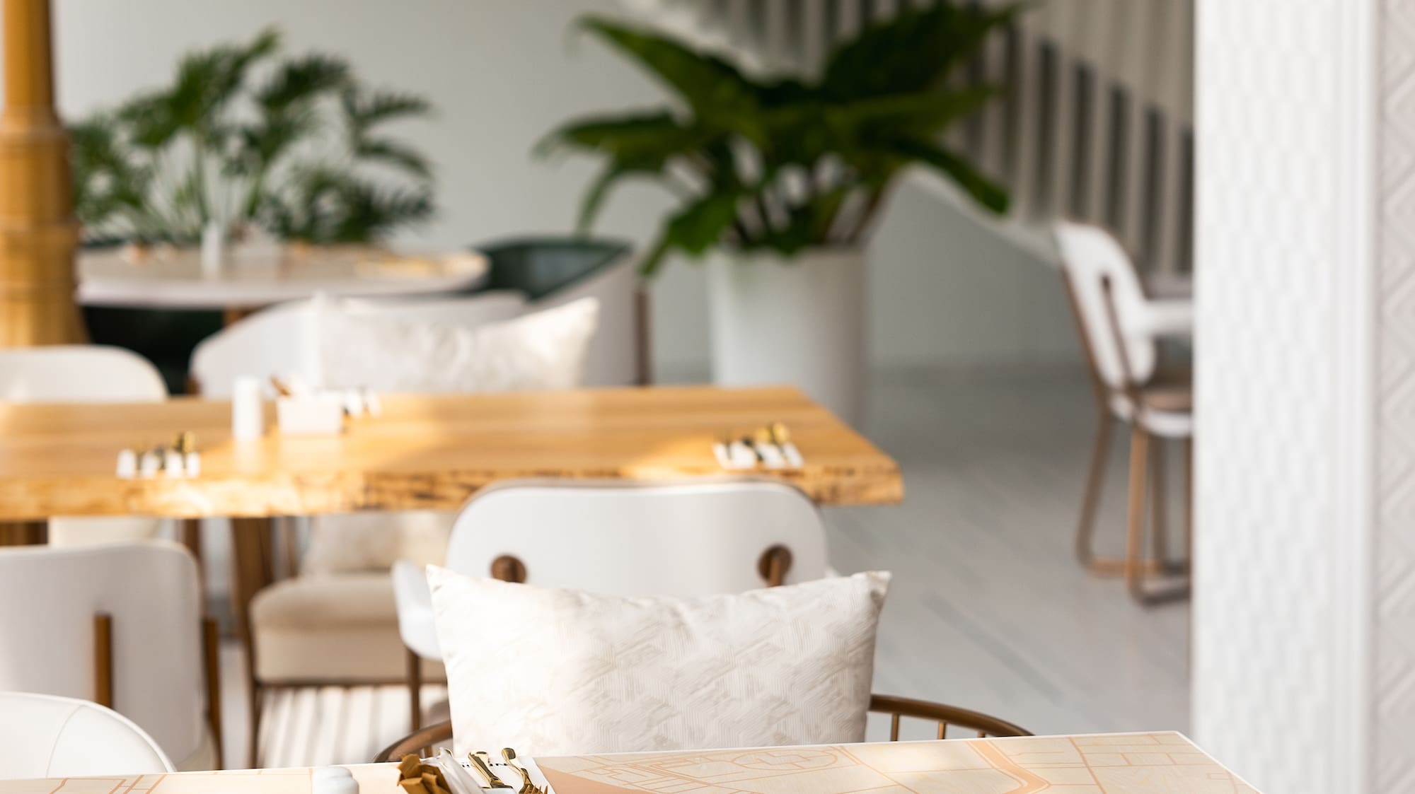 a table with gold utensils and a map on it