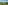 Helicopter over rolling green vineyards and hilltop village in a sunny wine region.