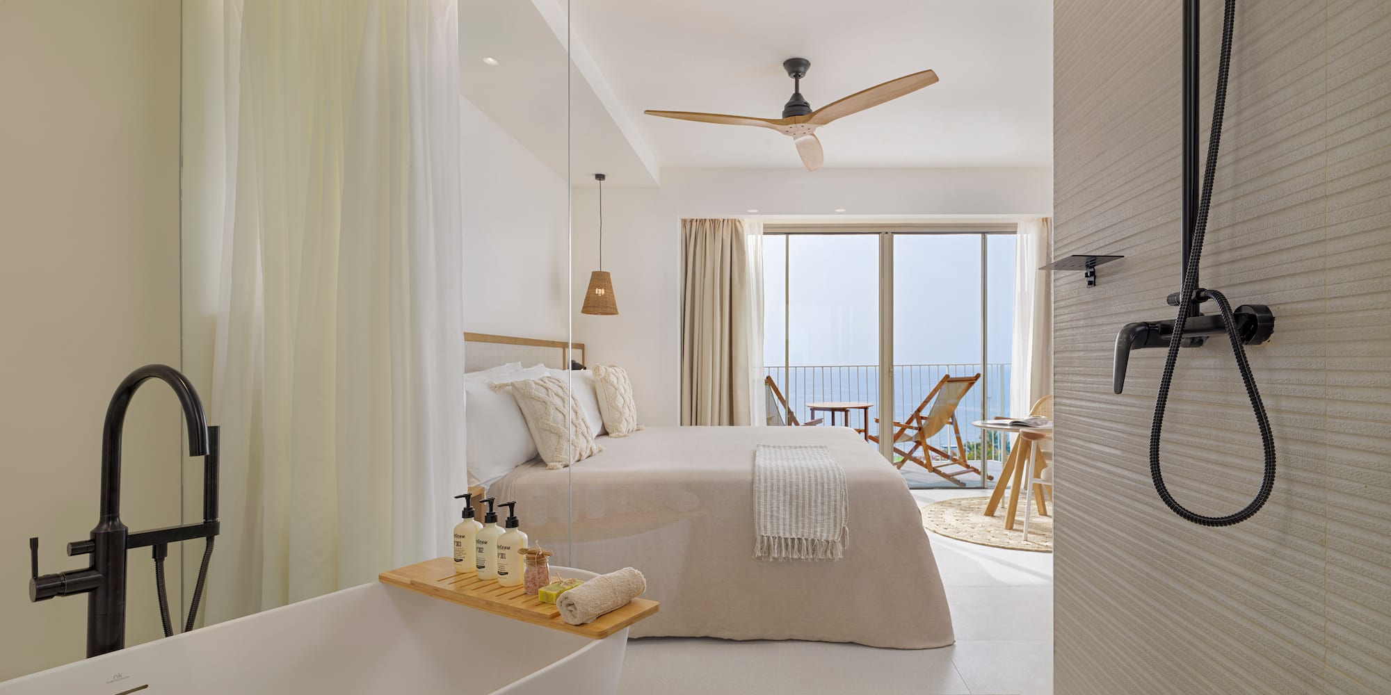 a bathroom with a bathtub and a bed