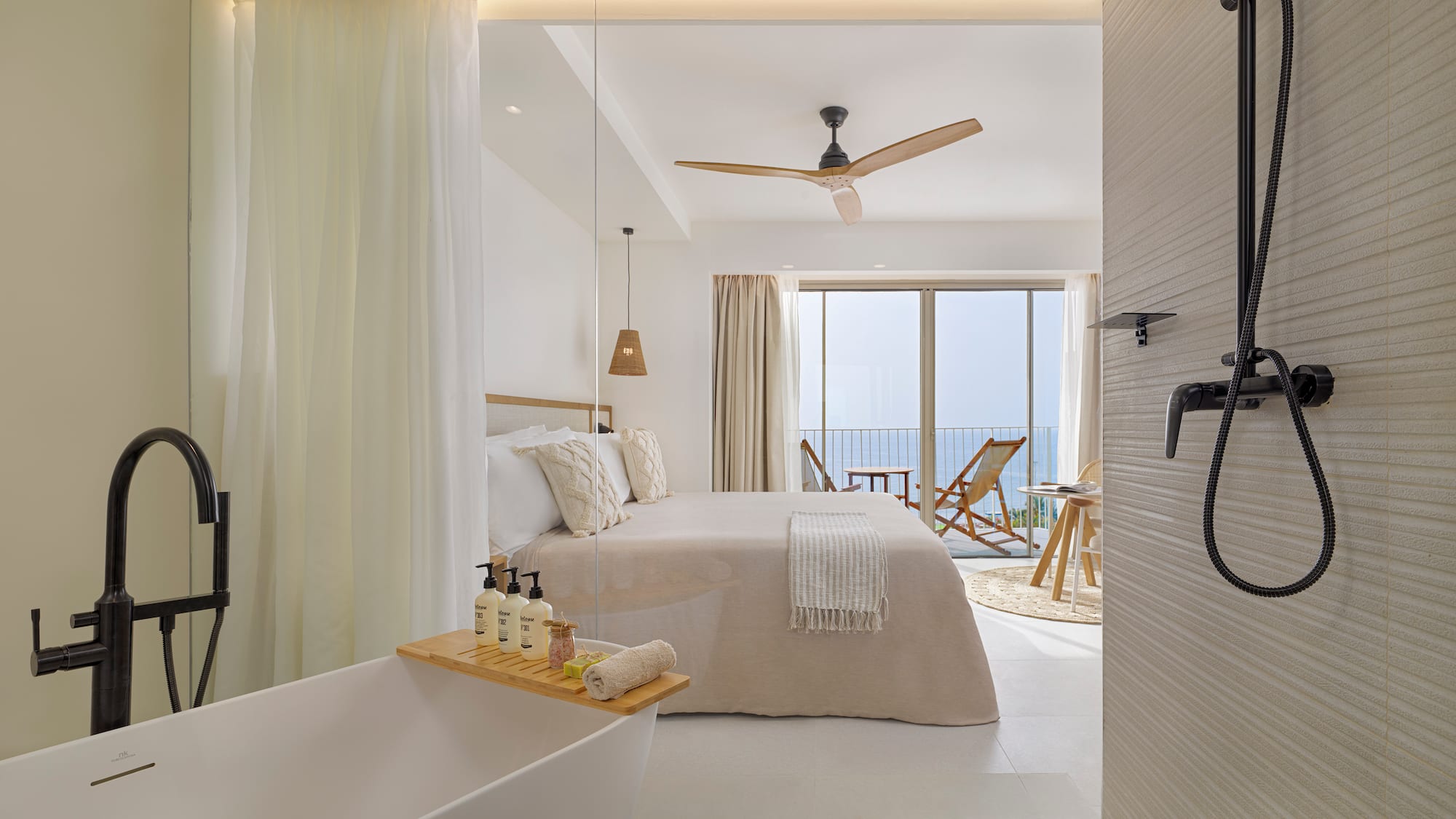 a bathroom with a bathtub and a bed