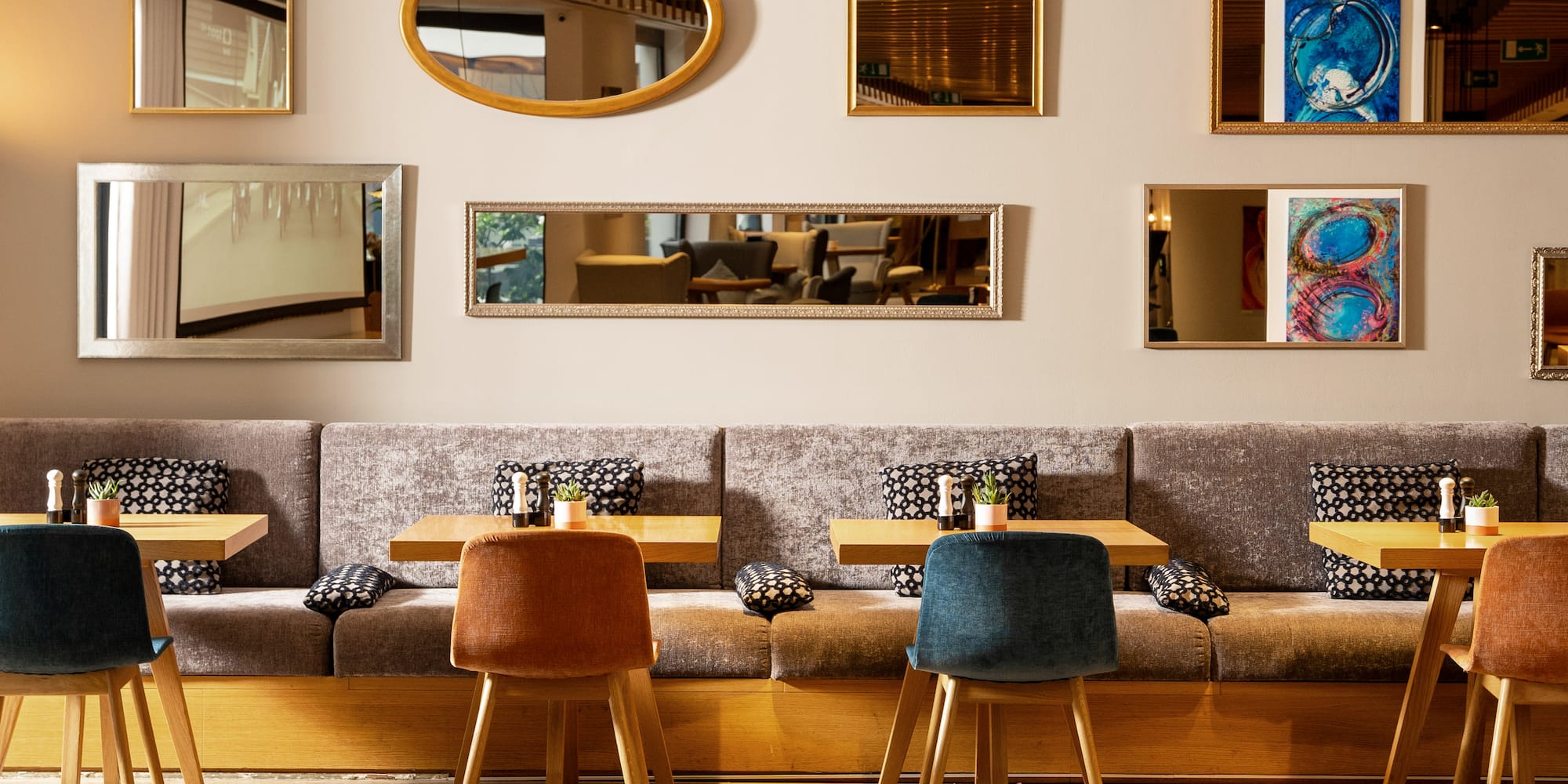 a room with a booth and tables