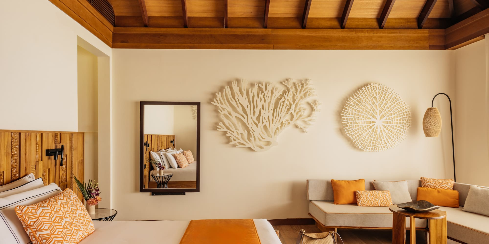 a room with a bed and couches