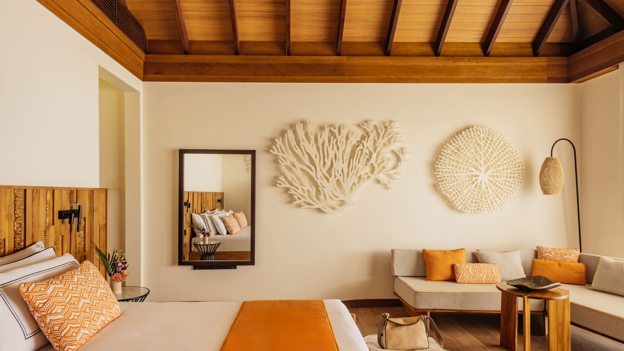 a room with a bed and couches