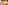 Luxury resort bedroom with wood ceiling, coral decor, and orange soft furnishings.