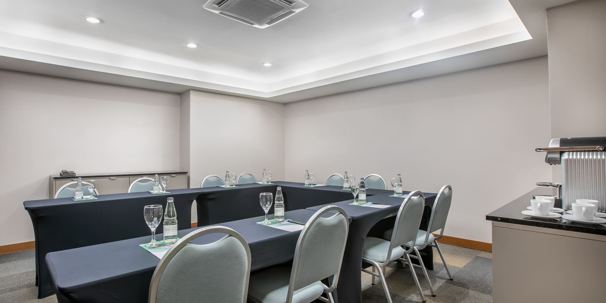 a room with a table and chairs