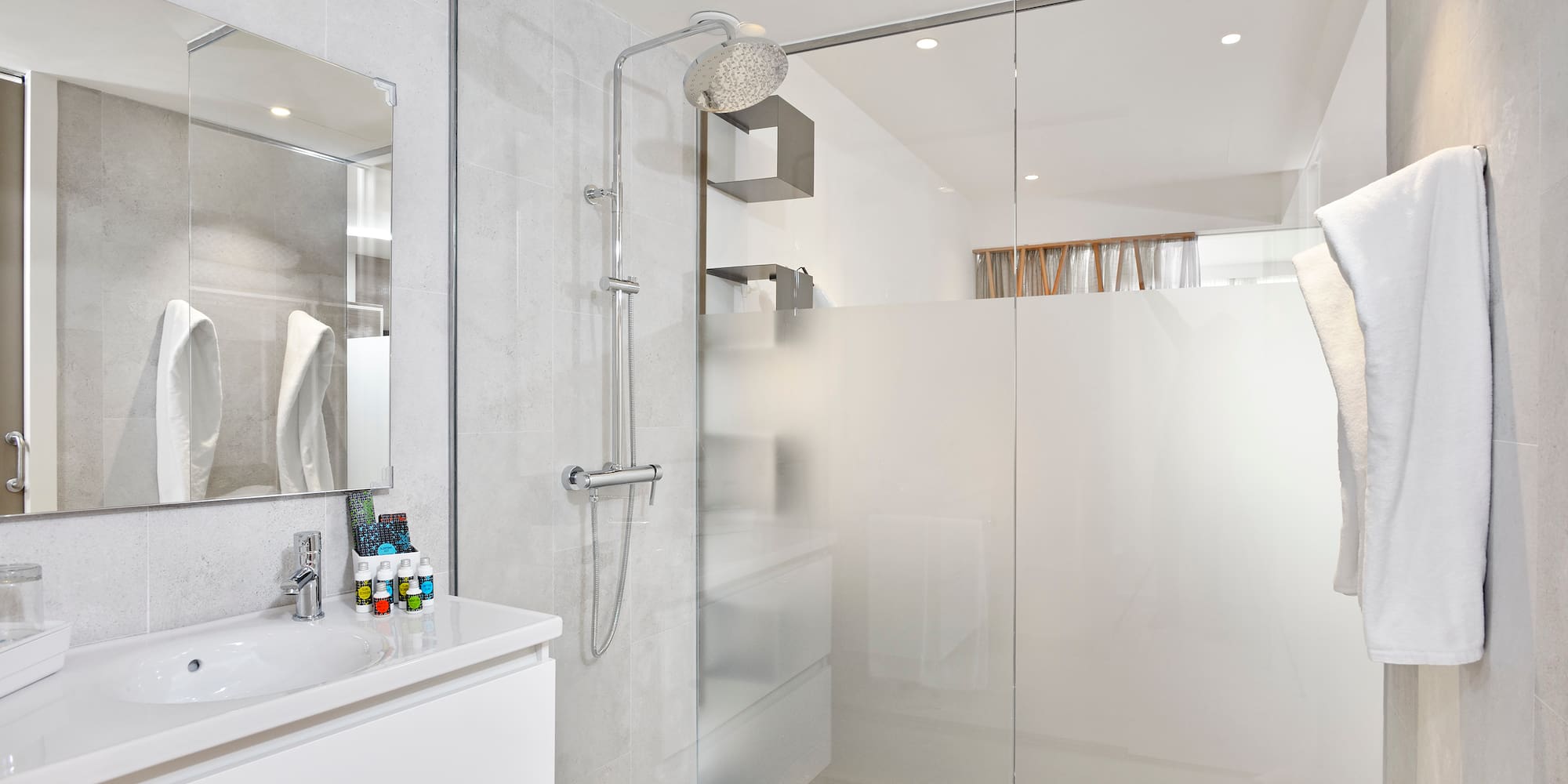 a bathroom with a shower and sink