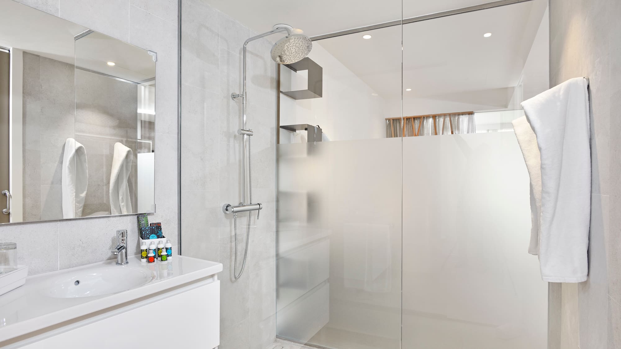 a bathroom with a shower and sink