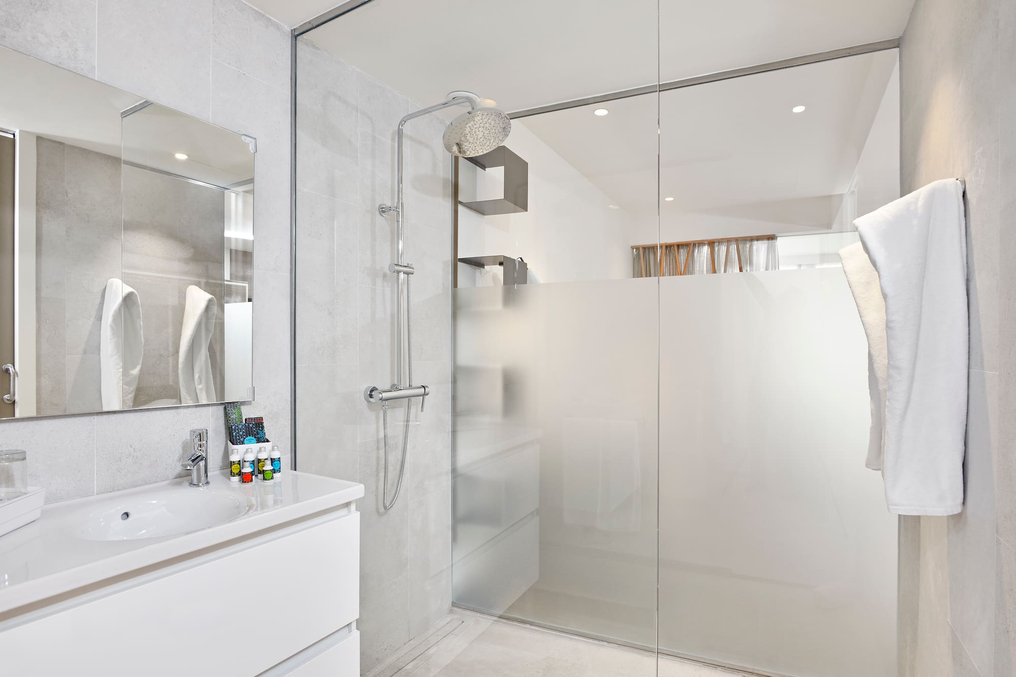 a bathroom with a shower and sink