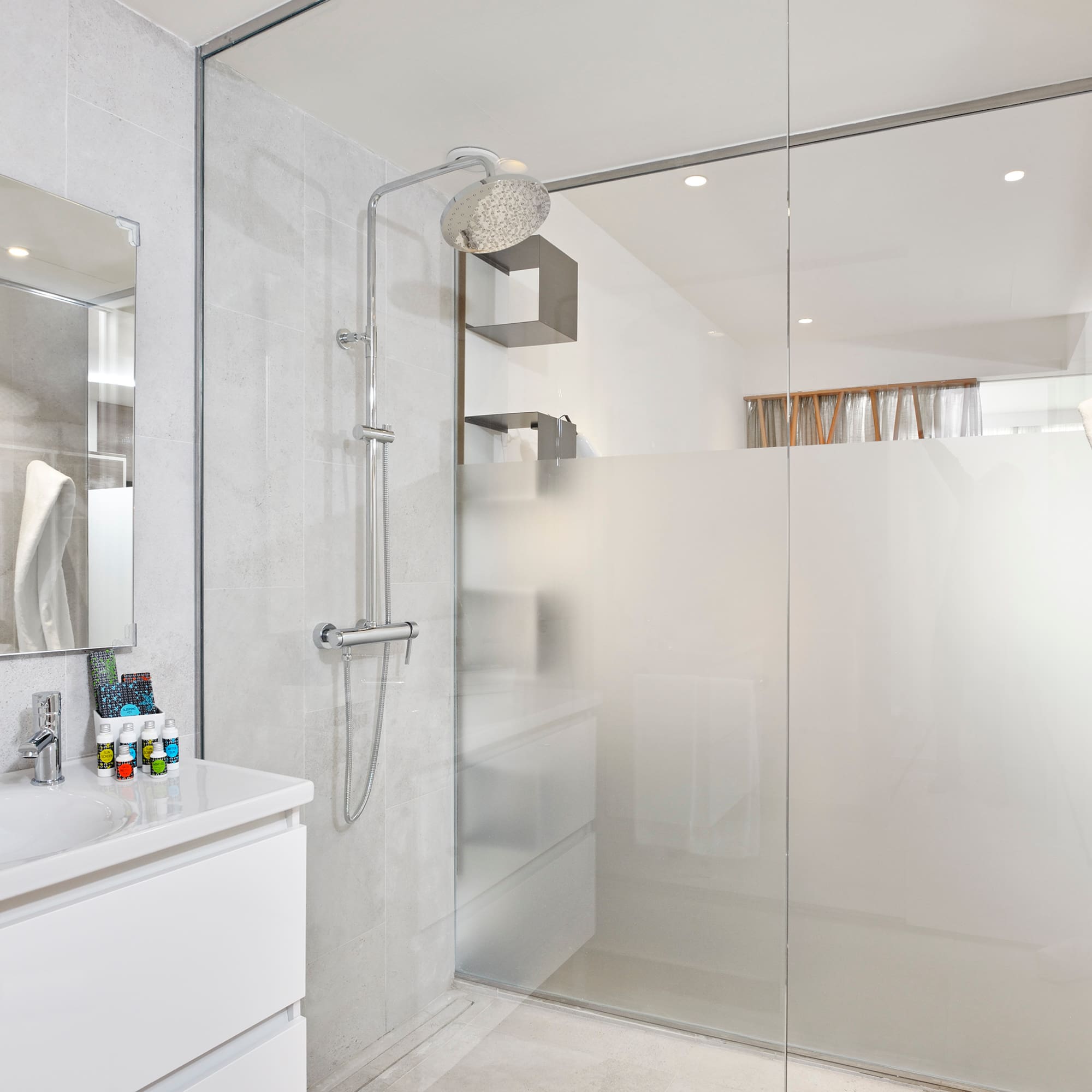 a bathroom with a shower and sink