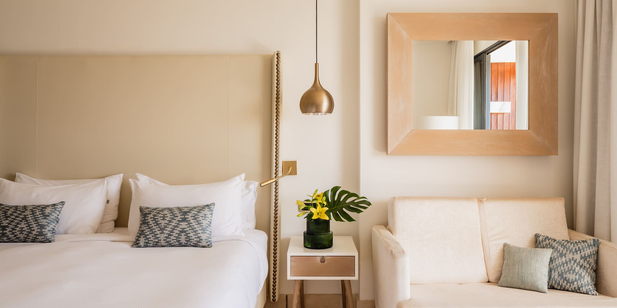 a bedroom with a bed and a couch