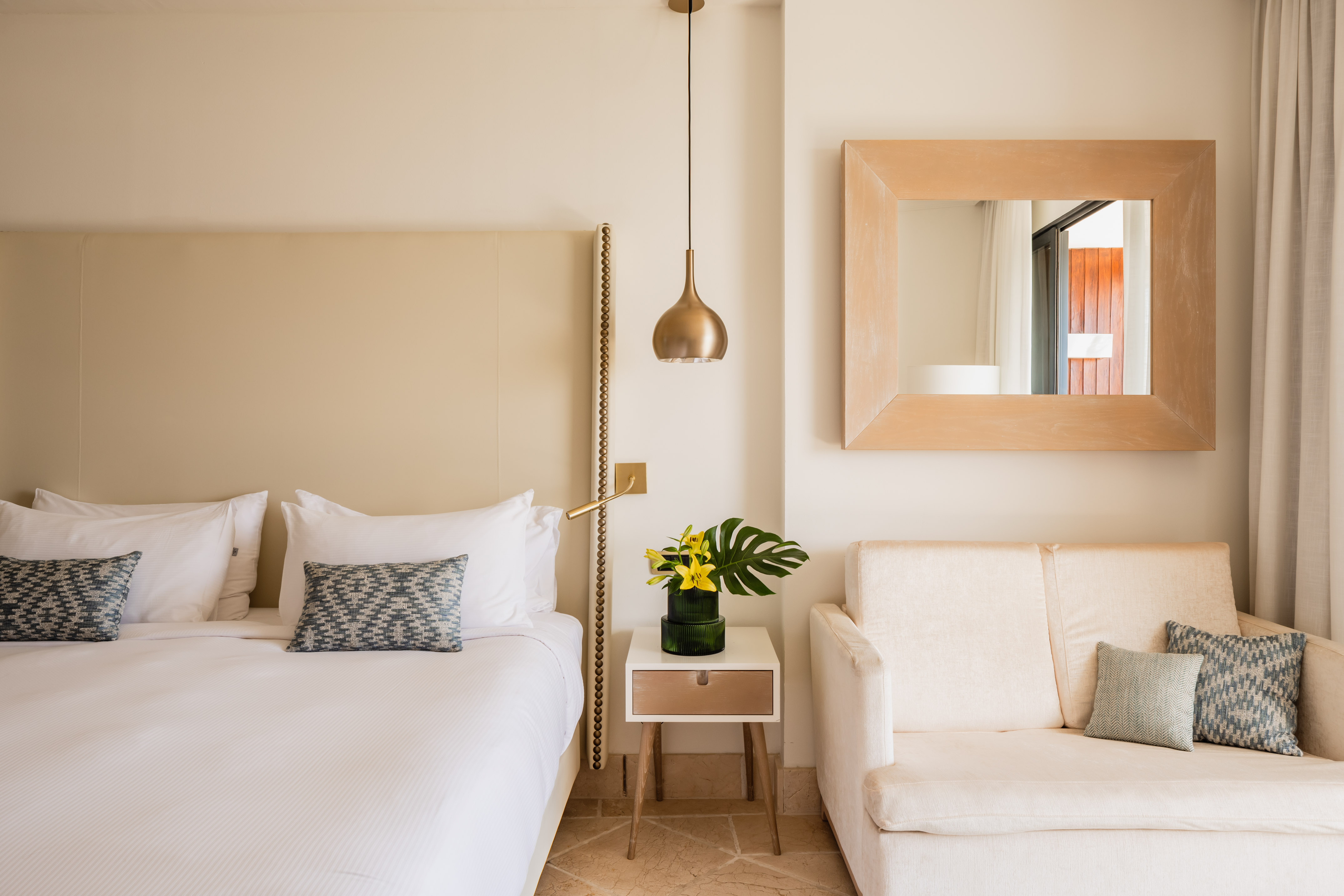 a bedroom with a bed and a couch