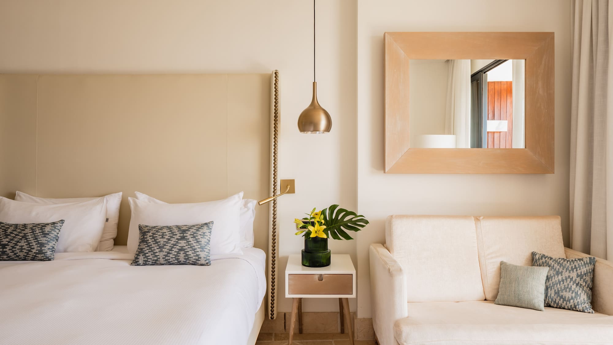 a bedroom with a bed and a couch