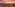 Vibrant sunset over resort hotel rooftop bar, ocean, and beach.