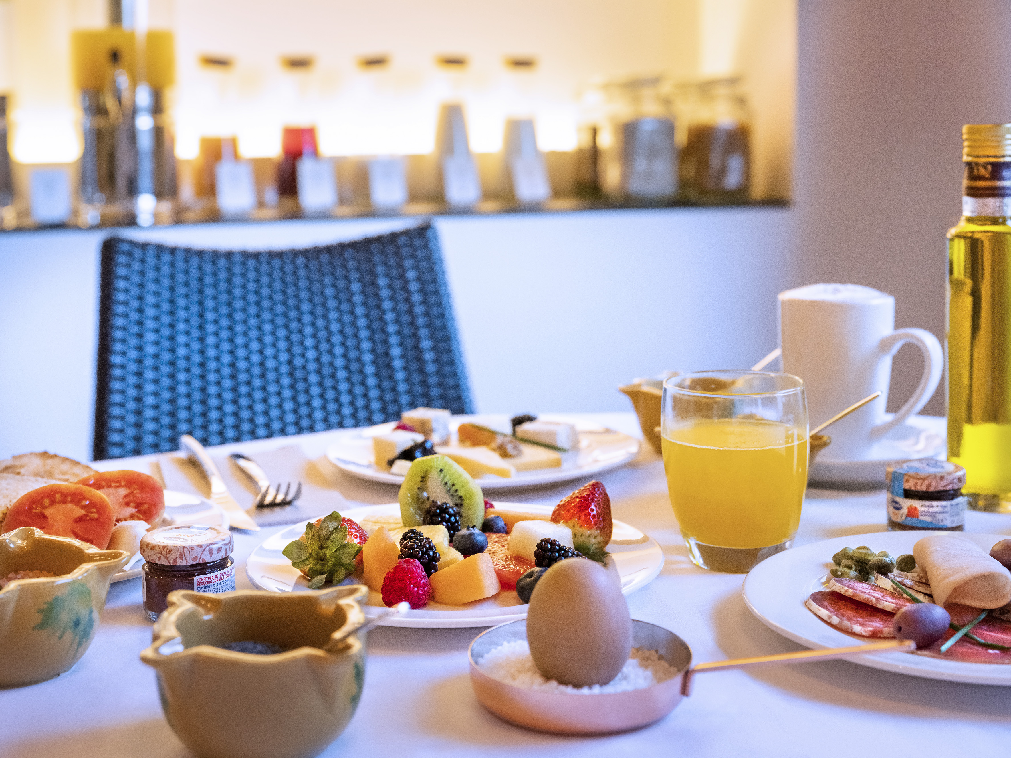 a table with plates of food and drinks