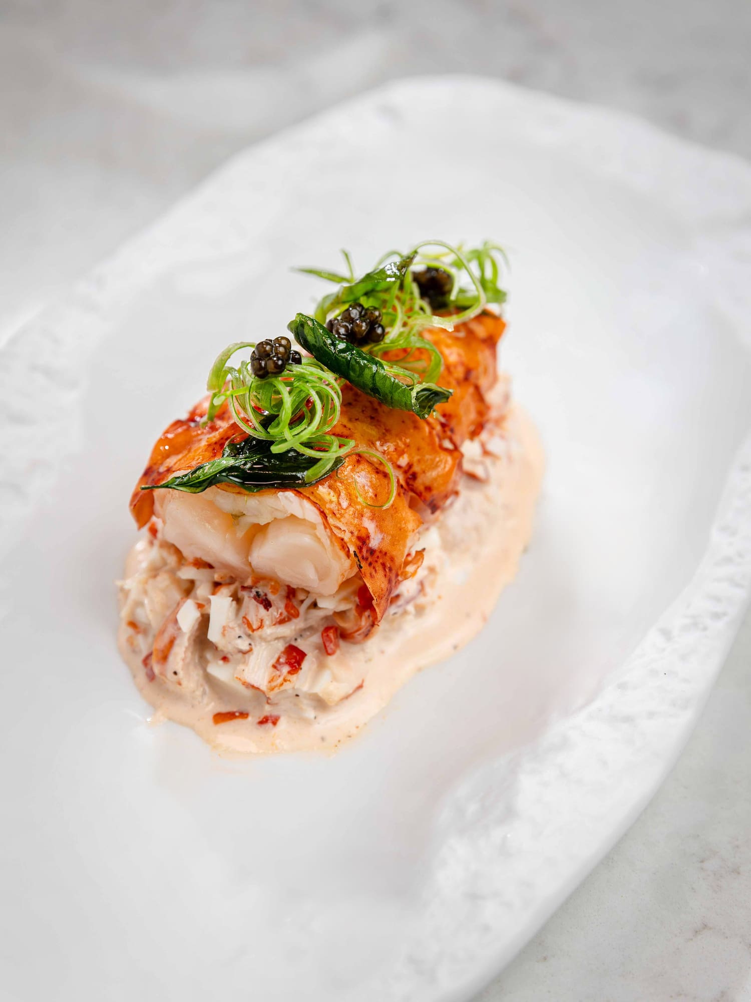 a plate of food on a white surface