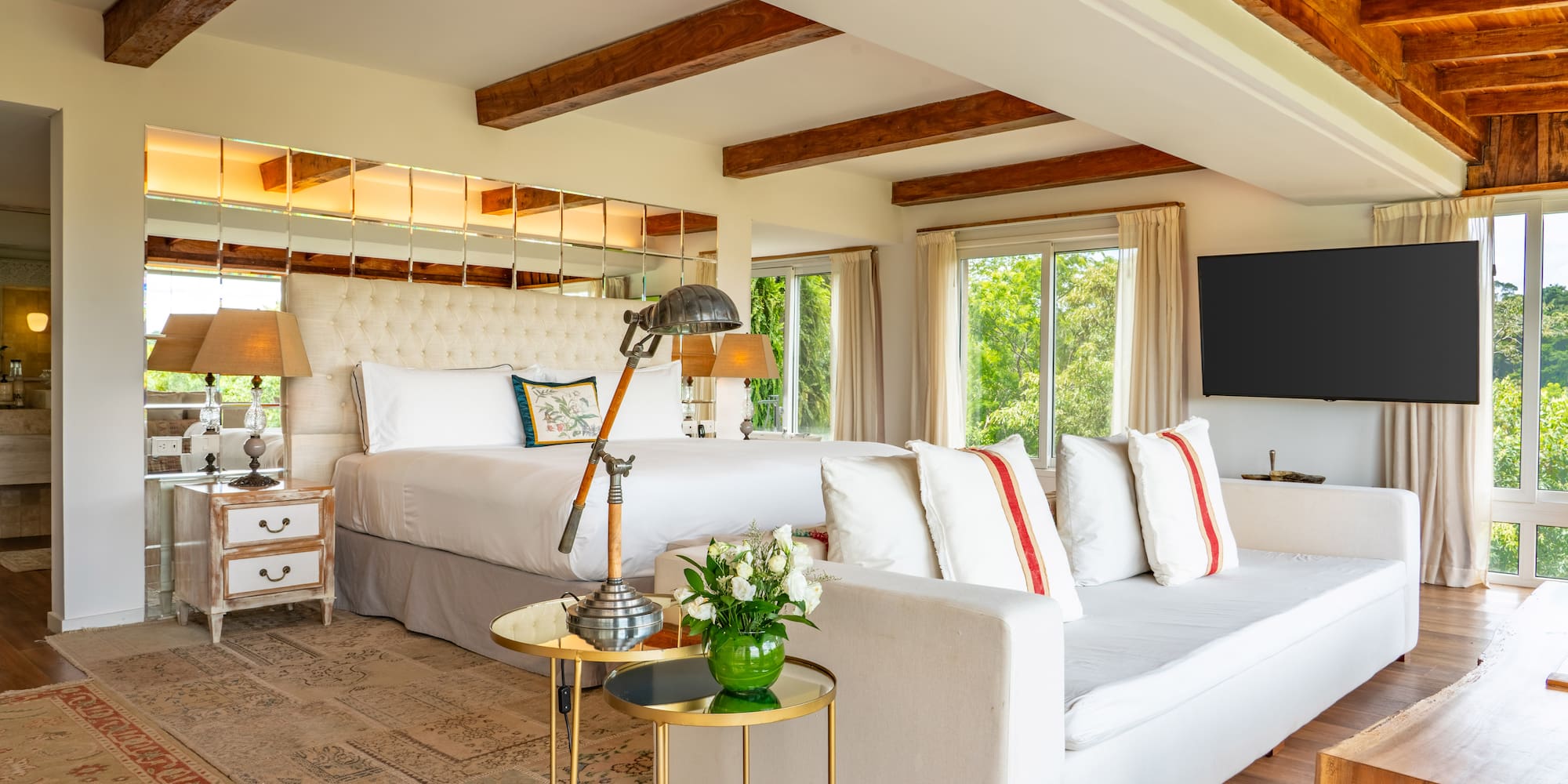 a room with a large bed and a television