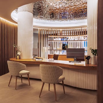 a desk with chairs in a room